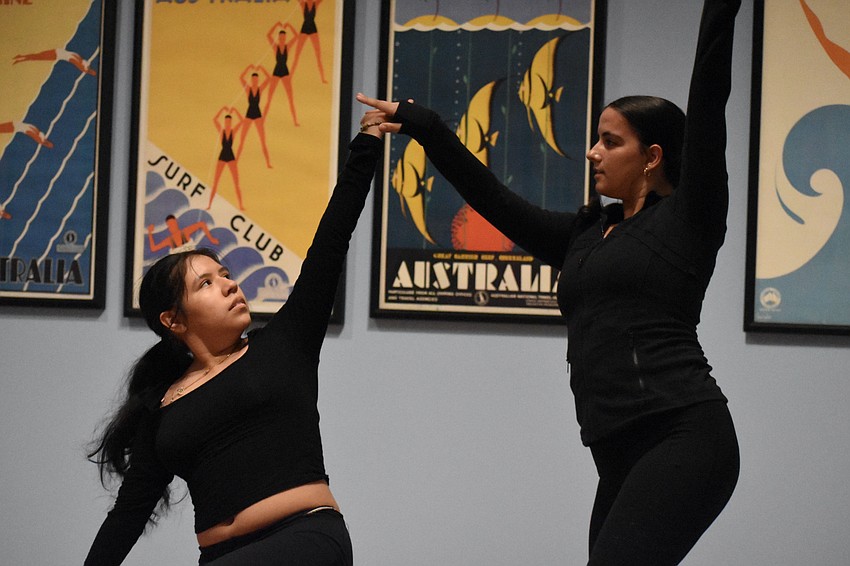 Booker High School juniors Daisy Rosas-Rios and Isabella Piazza dance in the second floor gallery.