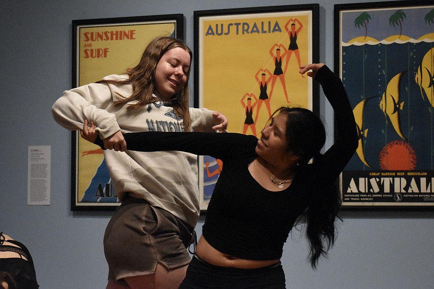 Booker High school graduate Molly Whipple and junior Daisy Rosas-Rios dance in the second floor gallery.