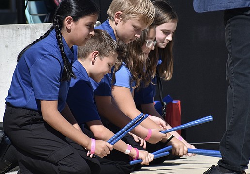 Fifth grader Ellah Nasr, fourth grader Nathan Rockwell, and fifth graders Peter Maslikhov, Evelyn Lambert and Hayden Oliva perform with the Ashton Elementary choir and soloists.