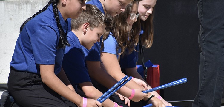 Fifth grader Ellah Nasr, fourth grader Nathan Rockwell, and fifth graders Peter Maslikhov, Evelyn Lambert and Hayden Oliva perform with the Ashton Elementary choir and soloists.