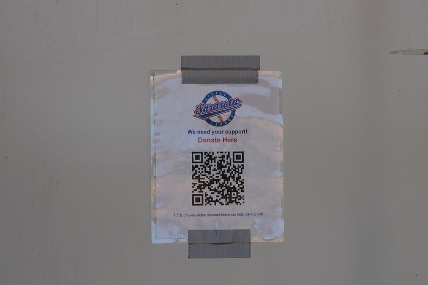A donation sign hangs on the bulletin board at Sarasota Little League's main building. As of Nov. 4, the league has raised over $17,000 on Zeffy en route to its $100,000 goal.