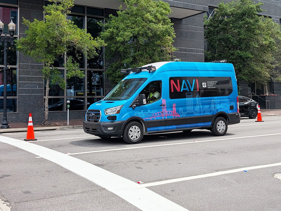 A Jacksonville Transportation Authority Neighborhood Autonomous Vehicle Innovation system van drives along Bay Street in Downtown. The NAVI system drew about 6,500 riders from its rollout in June through October. That’s an average of 76 passengers per day