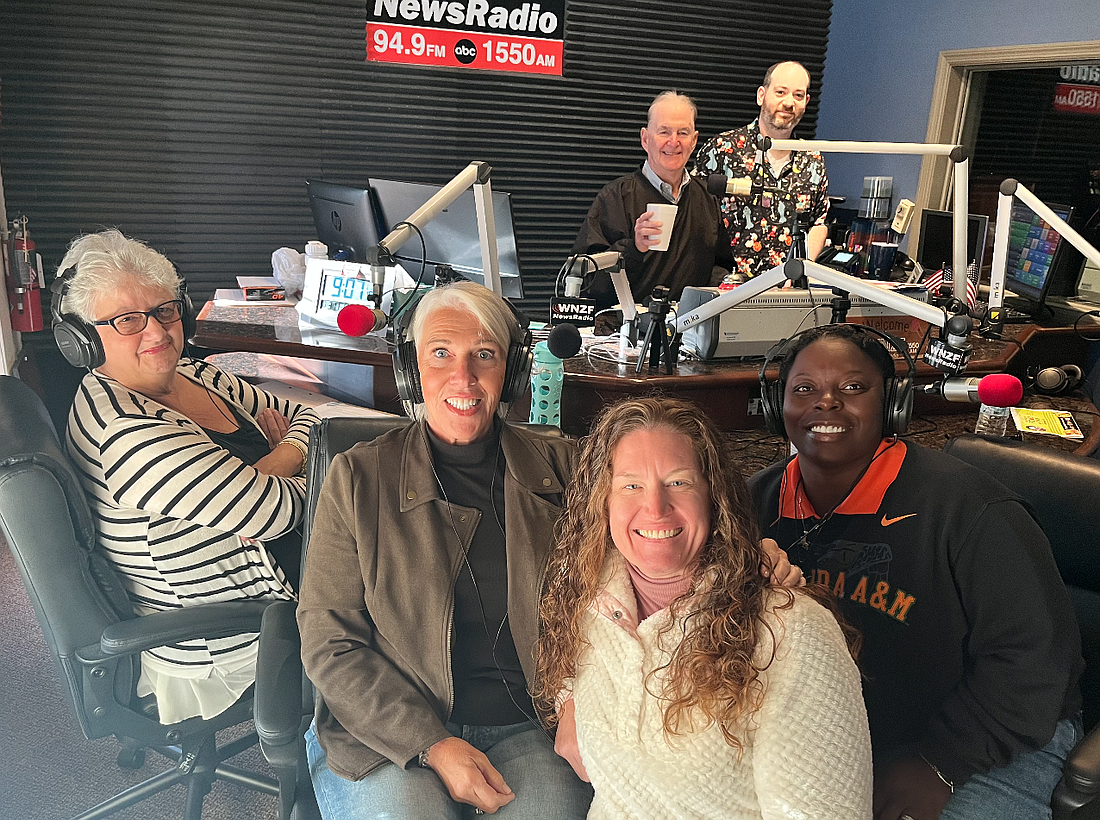 On Friday, Nov. 7, Flagler Radio will begin collecting donations for the food pantry through the third annual Million Dollar Food-A-Thon. Dottie Caletta, Pam Sansone, Jessie Zaccaro, and Rashawnda Miller. In back row, David Ayres and Marc Gilland.