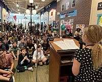 At a Junior Achievement "Discovery Center'' in Tampa, elementary-aged students run a mock city.Two similar facilities are proposed to be set up at Emma Booker Elementary and Booker Middle schools in Sarasota.