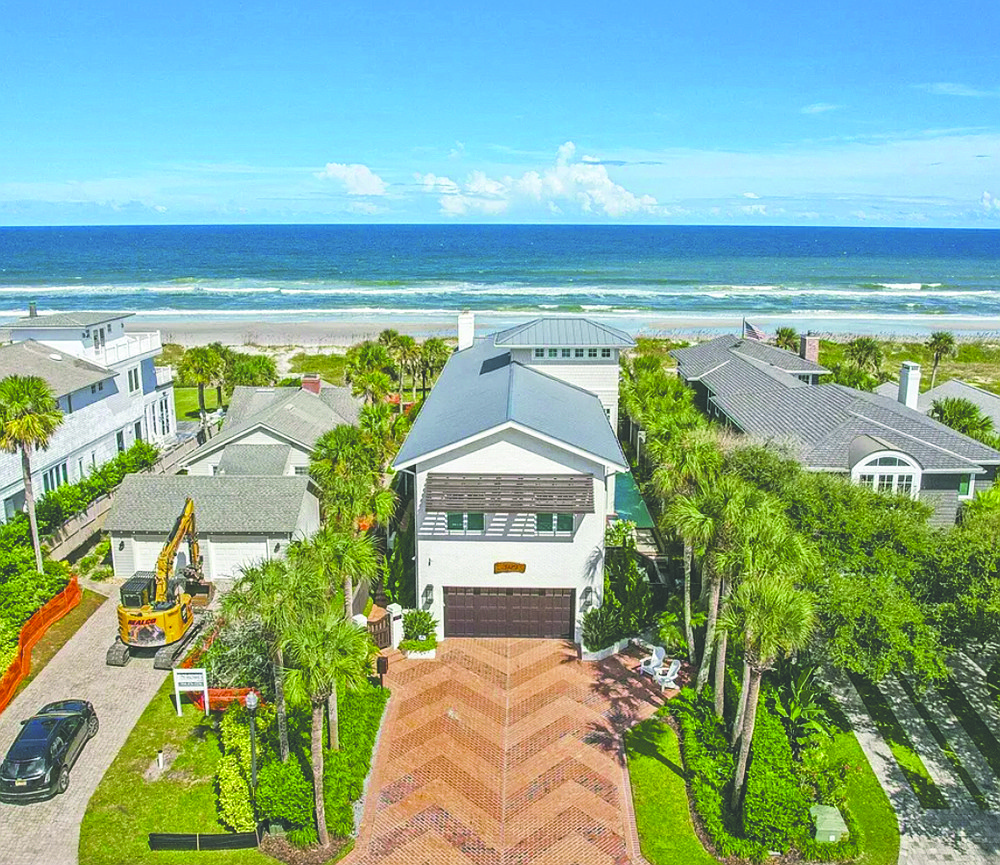 Oceanfront three-story home features, five bedrooms, four full and two half-bathrooms, courtyard, balcony, office, gym, decks, outdoor kitchen, pool and dune walkover.