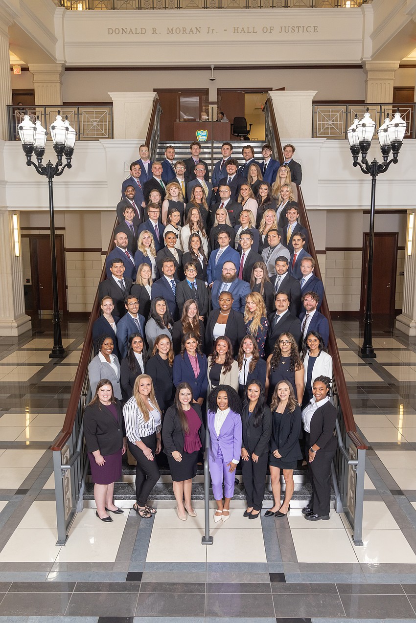 The student body at Jacksonville University College of Law on the Grand Staircase in the atrium at the Duval County Courthouse.