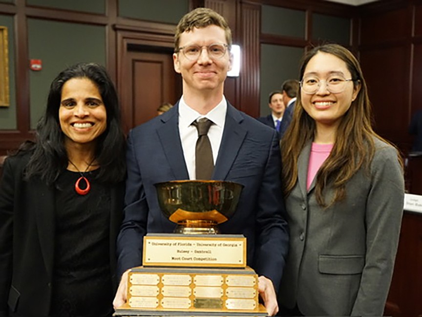 From left, University of Georgia School of Law Dean Usha Rodrigues and UGA law students Frank Easterlin and Grace Johnson.