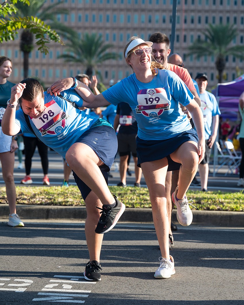 Special Olympics Florida athletes Madison Bevill, left, and Mallory Smith at the 5K Race for Inclusion where the JBA Young Lawyers Section raised more than $800 in donations.