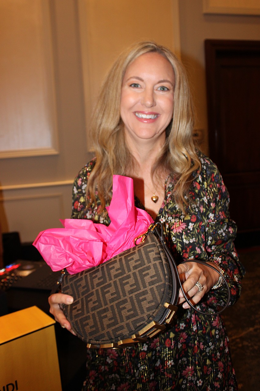 Brigid Saah used all six of her Bingo cards on one game, and hit the jackpot to win the Fendi purse.
