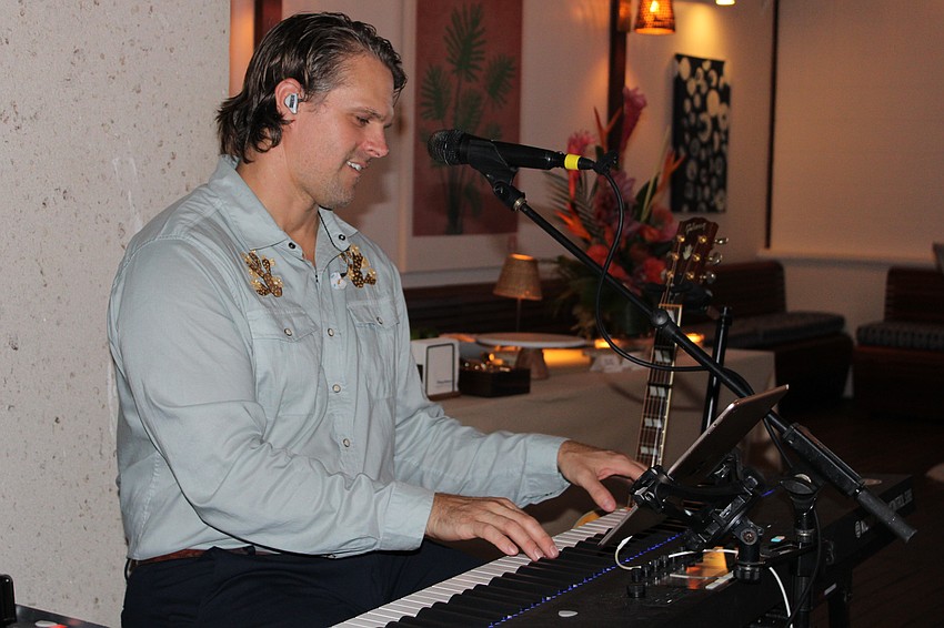 Jonathan Fleming tickles the ivories at the grand opening on Nov. 5 of the Tommy Bahama Restaurant & Bar on St. Armands Circle.