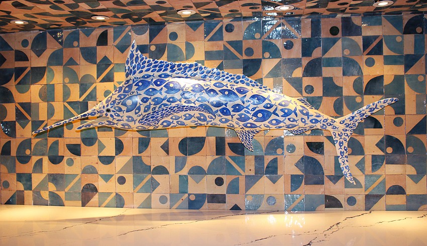 Tommy Bahama CEO Doug Wood said touches like the artist-crafted marlin mosaic paying homage to the brand help make the St. Armands location unique.