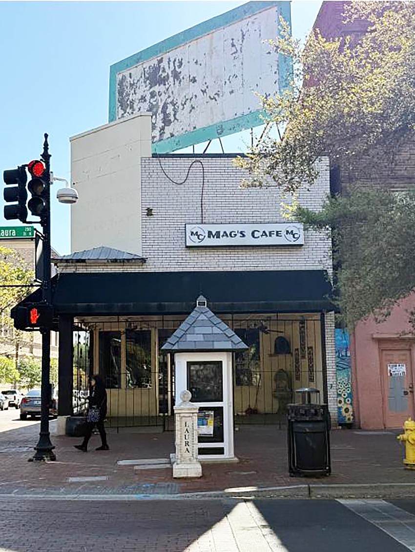 A Downtown Investment Authority report say city officials are in talks to improve a billboard on the roof of the closed Mag’s Cafe at 231 N. Laura St. building and coordinating use of it for the benefit of the city.