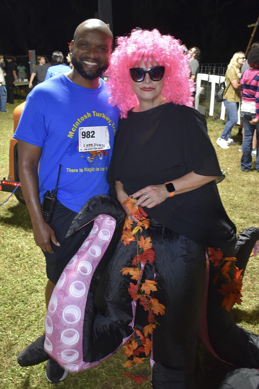 Principal McHenry Lerebours poses with science teacher Schelly Shaughnessy.