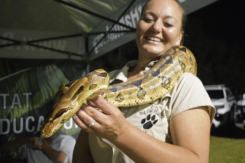 Sasha Kenyon of Big Cat Habitat showcases a boa constrictor, Zero.