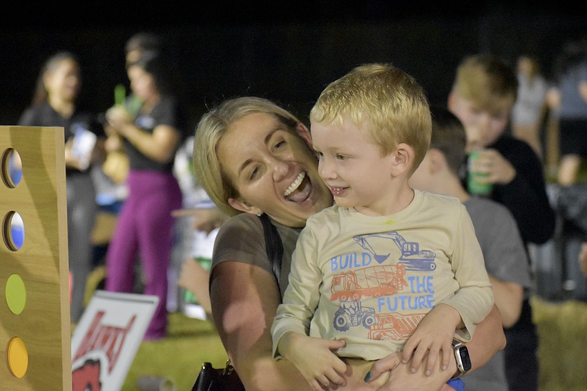 Jessica Gormley and her son Wyatt Gormley, 3, play a game of Connect Four.