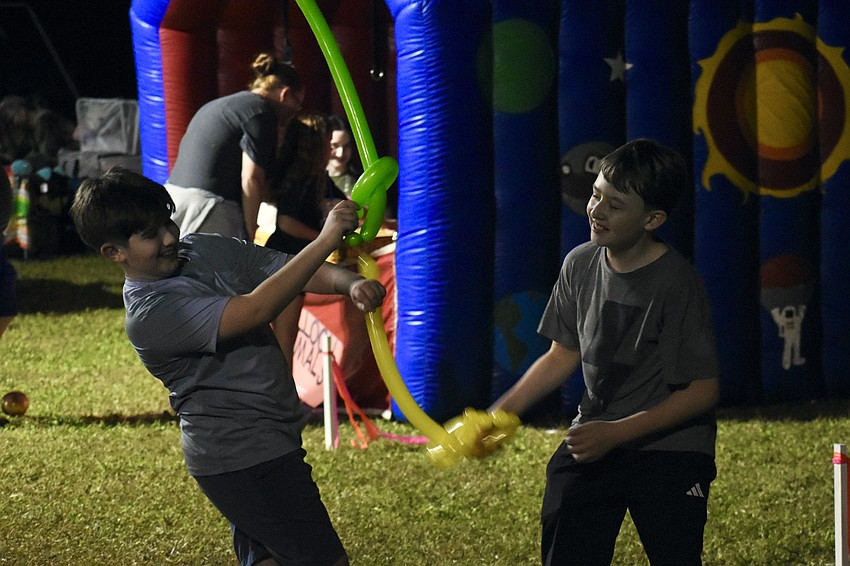 Vinnie Spelman, 11, and Aidan Watts, 11, have a swordfight.