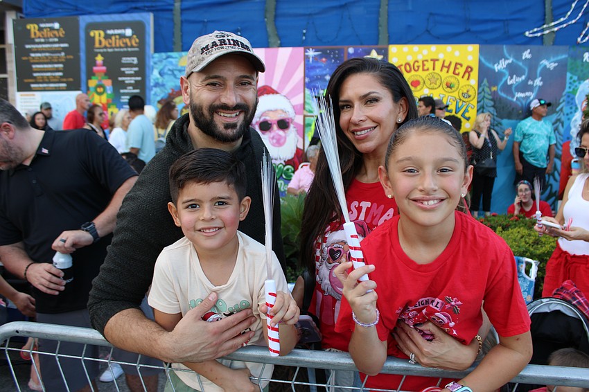 Lakewood Ranch's Greg and Christina Gordon are ready for the parade with Danny, 4, and Leila, 7, who had their glow sticks ready.