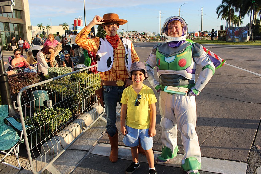 Lakewood Ranch 8-year-old Alex Cottalorda meets Woody and Buzz Lightyear at the Santa's Grand Arrival Parade Nov. 8 at UTC.