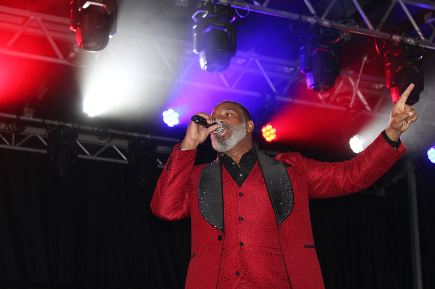Ty McFarlan, who is the host of the Wonderland Believe holiday show at UTC, addresses the crowd before the parade.