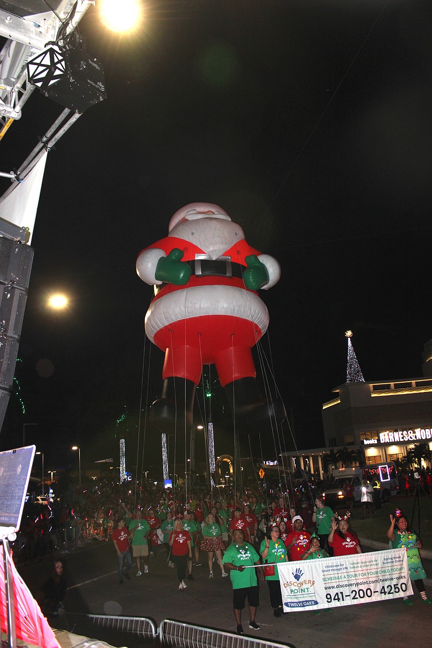 Ho ho ho. A Santa helium balloon towers over the Santa's Grand Arrival Parade route Nov. 8 at UTC.