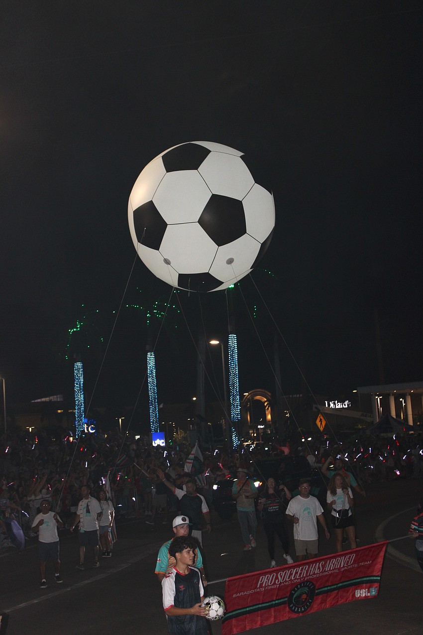 The Sarasota Paradise pro soccer team brought their ball, this one filled with helium, to the Santa's Grand Arrival Parade Nov. 8 at UTC.
