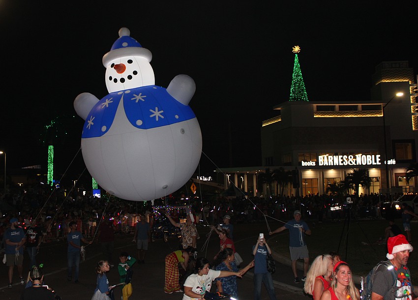 A helium-filled snowman ushers in the holiday shopping season at UTC during the Santa's Grand Arrival Parade Nov. 8 at University Town Center in Sarasota.