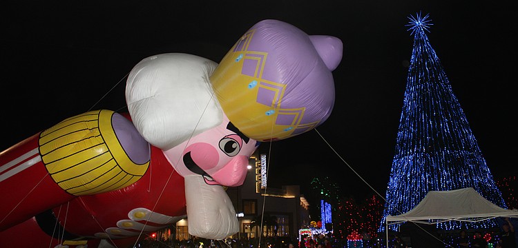 A giant helium-filled nutcracker takes a bow during the 2025 Santa's Grand Arrival Parade Nov. 8 at University Town Center in Sarasota.