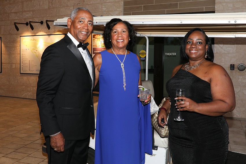 Grabbing a golf cart ride are Michael and Miriam Weir and Rhonda Calahan.