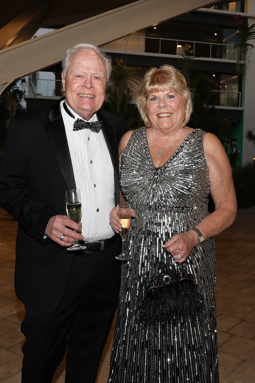 Dan Pollock and Debbie Orth complete the black tie attire with some cold bubbly.