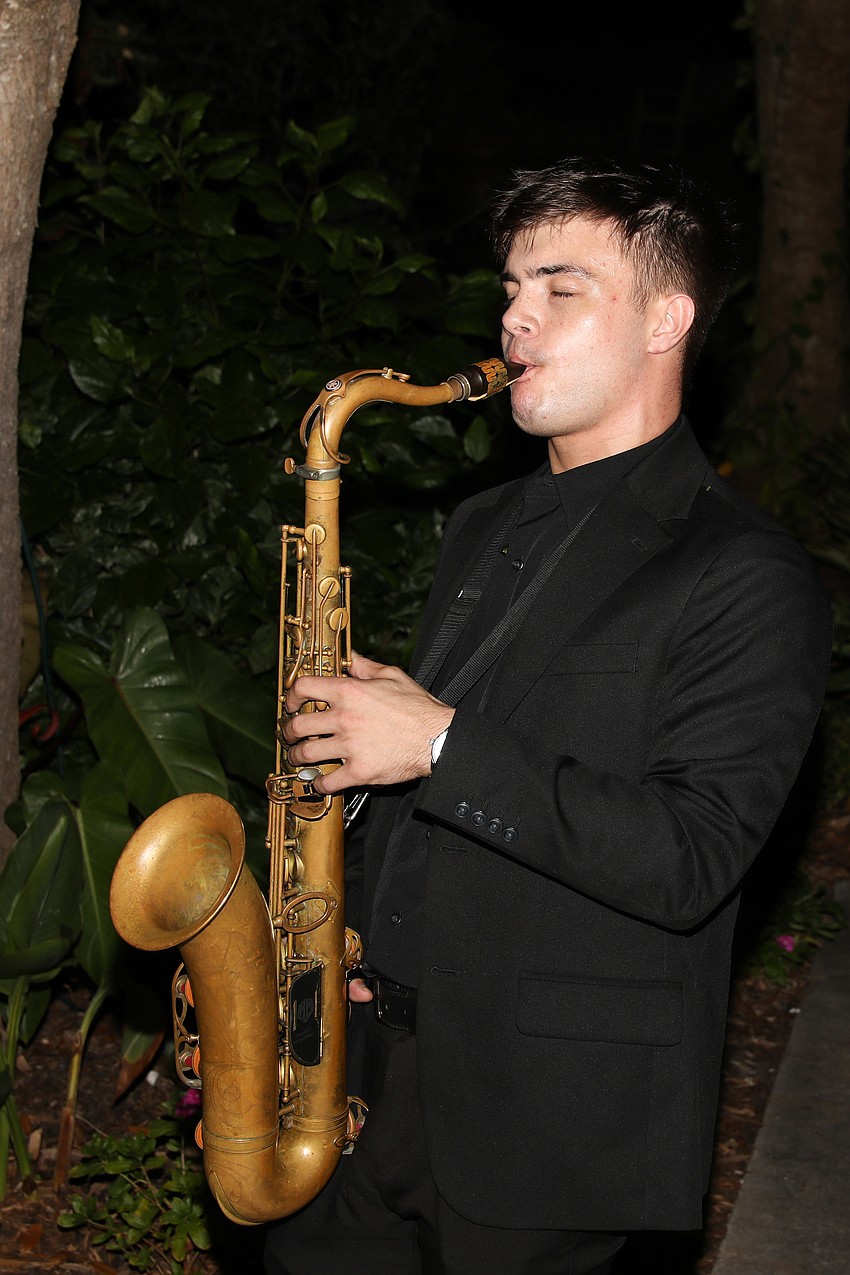 Nick Bredal solo-saxxed during the cocktail reception held on the bayfront.