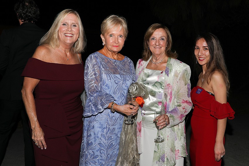 Susan Snyder, Barbara Gardner, Bonnie McIntyre and Ning Tinsley stop for a quick photo op before dinner.