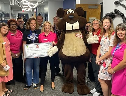 The Flagler County Education Foundation and Bucky the Beaver from Beaver Toyota presents a teacher grant. Courtesy photo