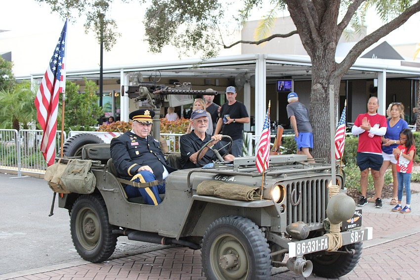 Major Dwight Thompson rides in the Tribute to Heroes Parade Nov. 9 in a jeep owned by Parrish's Dale Aylward.