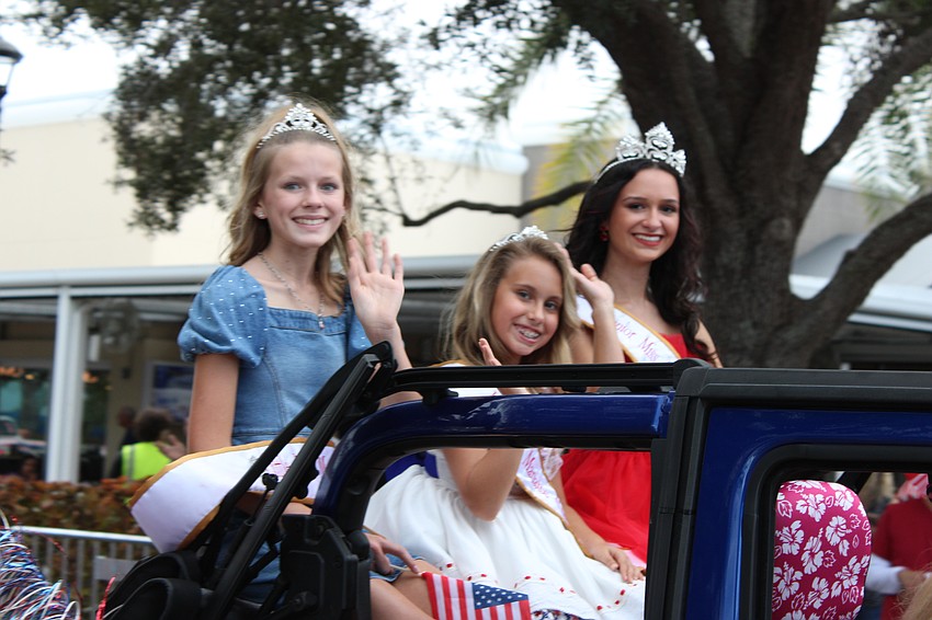 Little Miss Manatee Chloe Harmon, Mini Miss Emily Rose Dorics and Junior Miss Madison Huffman break out their parade wave during the Tribute to Heroes Parade in Lakewood Ranch Nov. 9.