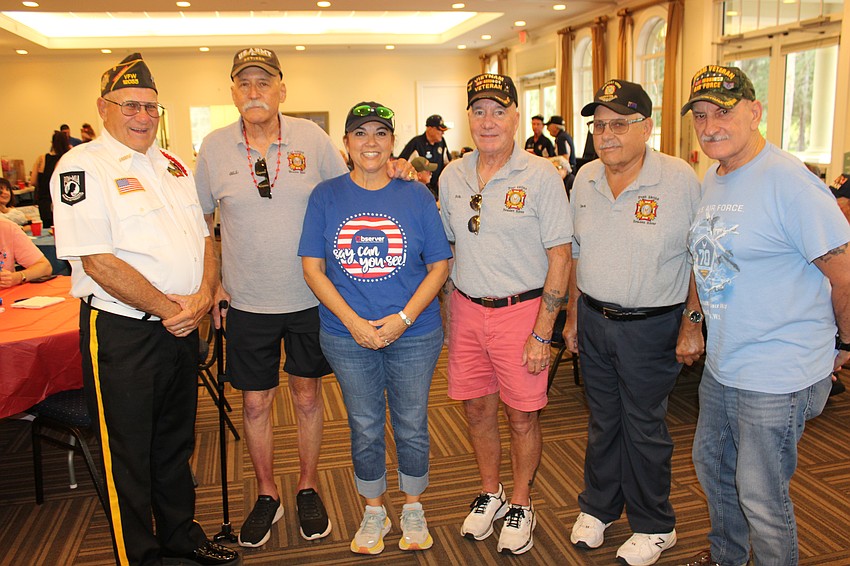 Air Force Vietnam veteran Chuck Slenker, Army Col. Gill Ruderman, the East County Observer's Lori Ruth, Army Sgt. Bob Hambrecht, Army E-5 Specialist Dan Huttinger and Air Force Staff Sgt. Joe Zummo meet at the parade dinner organized by Ruth.