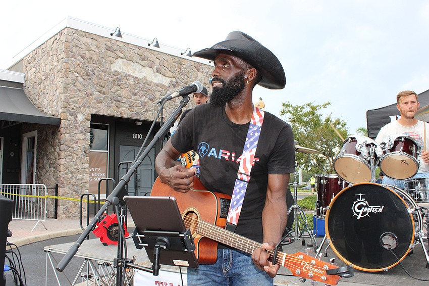 Country singer Jesse Daniels performed live on Lakewood Main Street before the Tribute to Heroes Parade Nov. 9.