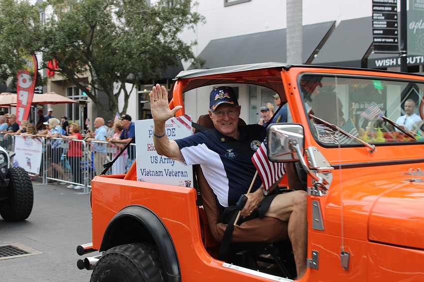Vietnam veteran Rick Davis is honored with a ride in the Tribute to Heroes Parade.