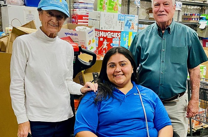 Sue Wertman from Christ Church of Longboat Key, Britney Vela, pantry manager at Our Daily Bread, and Mark McLaughlin, board president of Our Daily Bread of Bradenton.