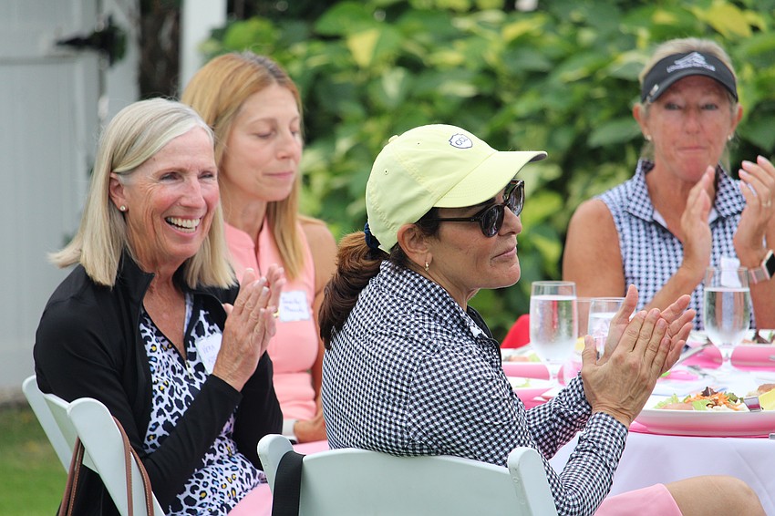 Tables applaud the winners of a mixed-format scramble on Nov. 6 at Longboat Key Club.