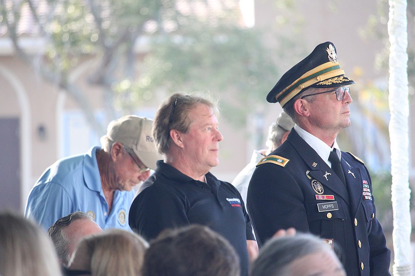 Goodwill Manasota Veterans Services Career Development Facilitator Randy Wright and Public Works Director Charles Mopps stand to be recognized for their service at the Longboat Key Veterans Day ceremony.