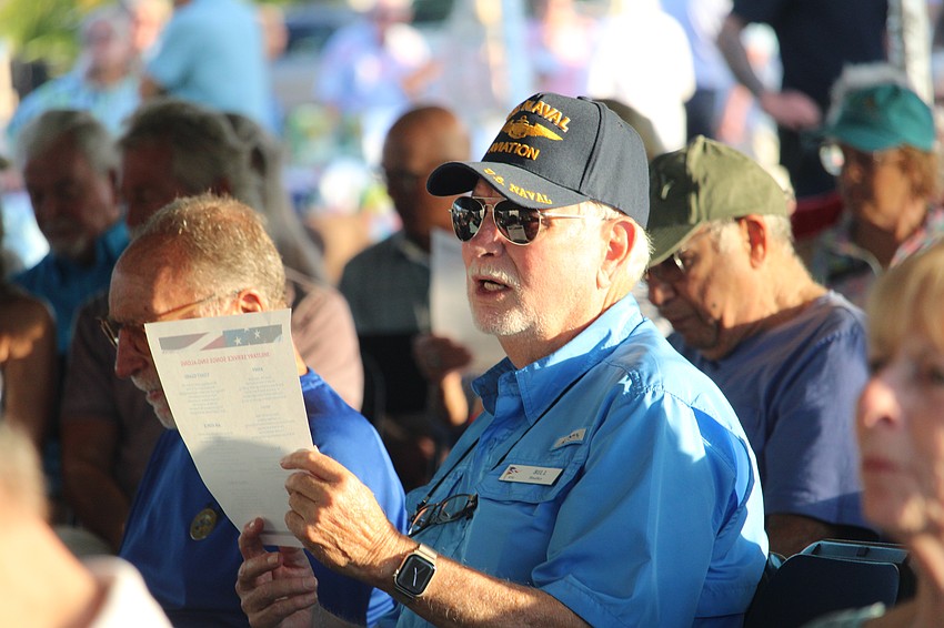 Bill Hadley adds his voice to those singing the military service songs at the Nov. 8 Veterans Day and anniversary event.