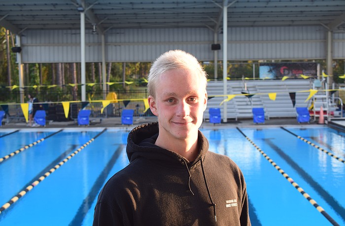 Bogdan Zverev poses for a photo on Nov. 10 after a Sarasota Sharks practice at Selby Aquatic Center. The senior is headed to Alabama next fall, but first, he's playing a major role for Sarasota boys' swimming and diving in pursuit of a state title.