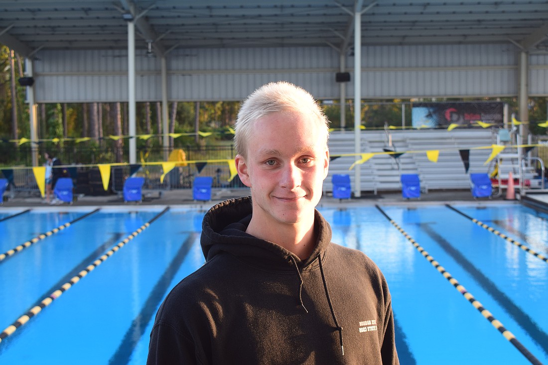 Bogdan Zverev poses for a photo on Nov. 10 after a Sarasota Sharks practice at Selby Aquatic Center. The senior is headed to Alabama next fall, but first, he's playing a major role for Sarasota boys' swimming and diving in pursuit of a state title.