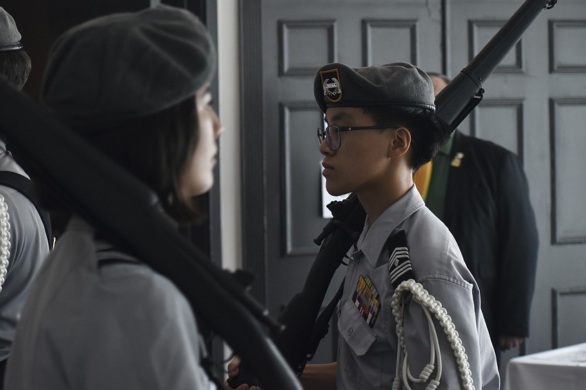 Sarasota Military Academy students Vivienne Sarabia, a senior and Benson Van, a junior, serve in the Color Guard.