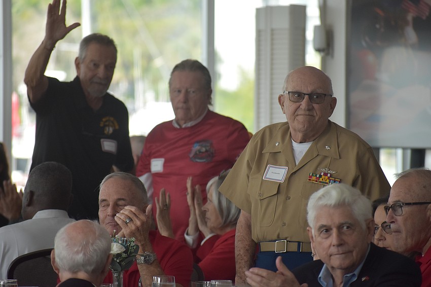 Jim Govostes, William Slater and Tony Mediavilla stand to be recognized.