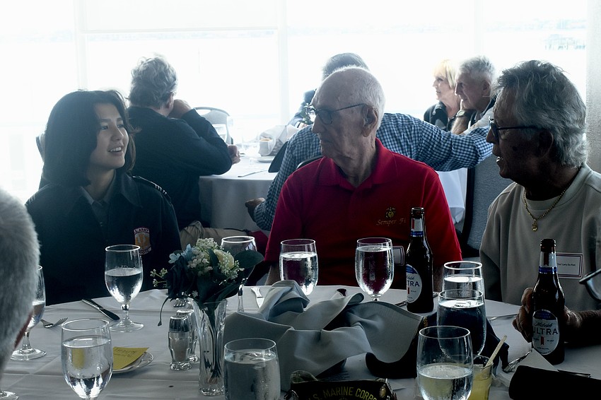 Sarasota Military Academy student Vivienne Sarabia, a senior, talks with Antonio Longo and 