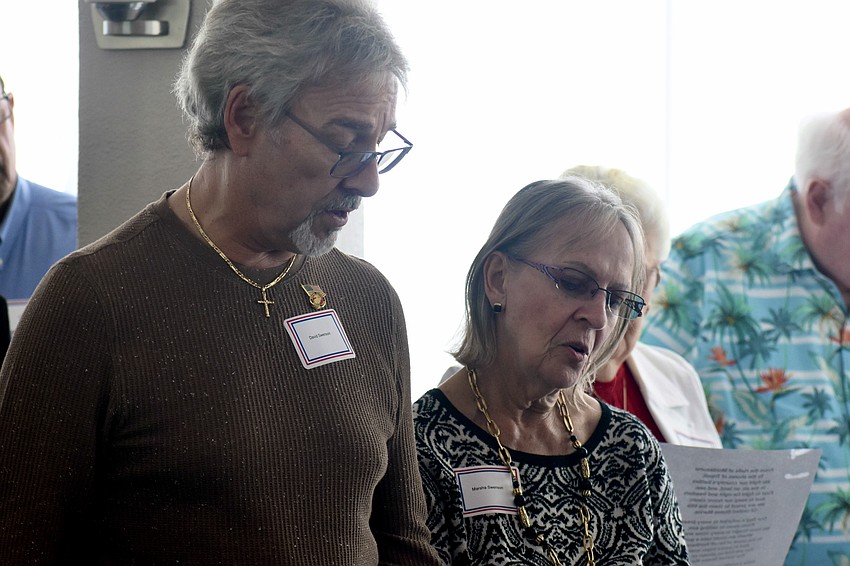 David Swenson and Marhsa Swenson sing the Marines' Hymn.