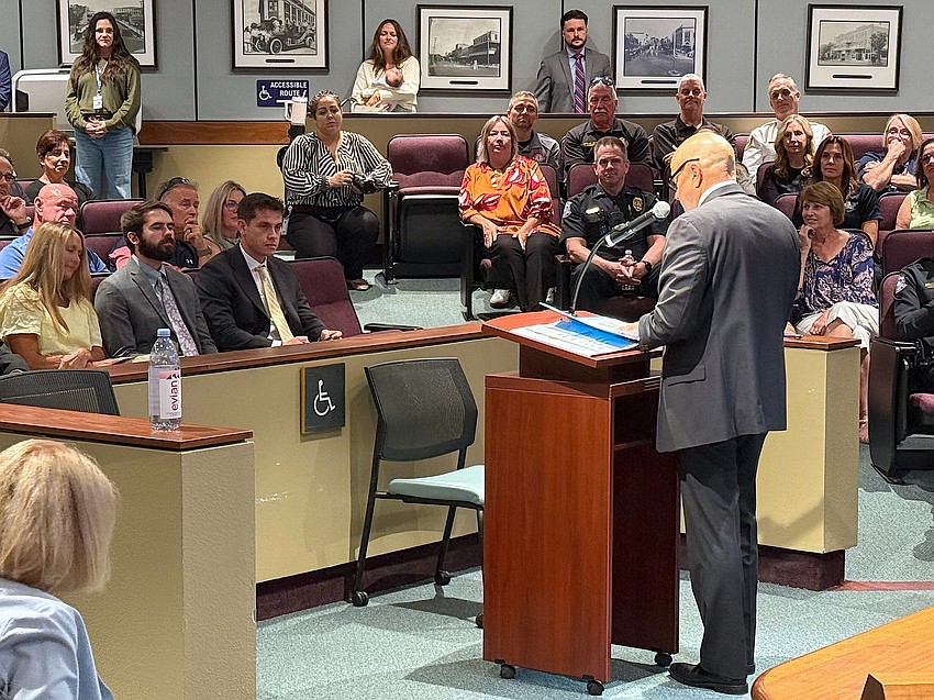 With family members seated in the front row, retired Sarasota Police Department Capt. Demetri Konstantopoulos speaks of his 28 year with the SPD.