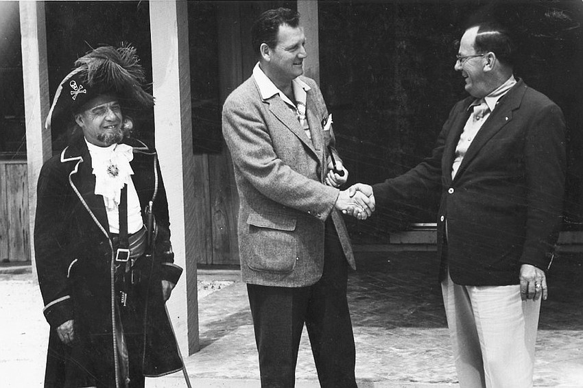 Herb Field, founder of the Buccaneer Inn and The Colony, shakes hands with former Longboat Key mayor Will LePage. LePage was the town's first mayor in 1955.