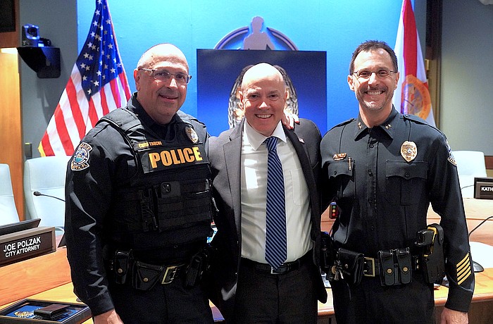 From left, Sarasota Police Chief Rex Troche, retired Capt. Demetri Konstantopoulos and Deputy Chief Scott Mayforth following Konstantopoulos' retirement ceremoony.